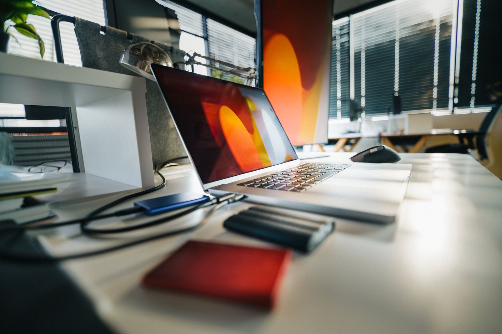 External storage devices connected to a laptop on an office desk
